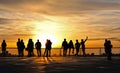 Silhouettes of people on warm colorful sunset on river Danube in Belgrade, Serbia