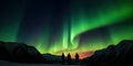 silhouettes of people who observe an aurora a natural phenomenon of Northern Lights Royalty Free Stock Photo