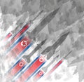 Silhouettes of rocket against the background of the flag of North Korea. Military background. Conflict in Asia. Royalty Free Stock Photo