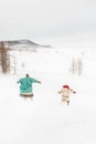 Silhouettes of running nomads of the Polar circus