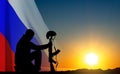 Silhouettes of russian soldiers on background of sunset