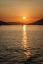 Silhouettes of sailing yachts against the backdrop of a bright orange sunset in the sea. Romance and relaxation. Magnificent Royalty Free Stock Photo