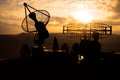 Silhouettes of satellite dishes or radio antennas against sunset sky. Space observatory