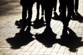 Silhouettes and shadows of people on the street