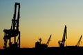 Silhouettes of shipyard cranes Royalty Free Stock Photo