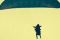Silhouettes of skydivers in a yellow sky Royalty Free Stock Photo