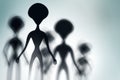 Silhouettes of spooky aliens and bright light on behind them