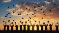 Silhouettes students graduate caps sunset Royalty Free Stock Photo