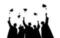 Silhouettes of students throwing mortarboards