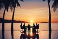 Silhouettes of successful business people working on meeting on a beach. Royalty Free Stock Photo