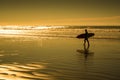Silhouettes of surfer in sunset Royalty Free Stock Photo