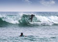 Silhouettes of a surfers.