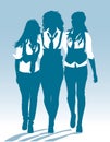 Silhouettes of teenage schoolgirls walking together