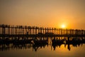 Silhouettes of tourists in boats admiring U Bein bridge over the Taungthaman Lake at sunset, in Amarapura, Mandalay Myanmar Royalty Free Stock Photo