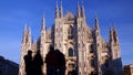 Silhouettes of tourists in front of Duomo di Milano or Milan Cathedral, main landmark in the centre of the city. Italy Royalty Free Stock Photo