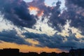 Silhouettes of tower cranes and buildings under construction on the background of the sunset sky. Back light. Large construction Royalty Free Stock Photo