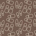 Silhouettes of traces of shoes . Footprints of human shoes. Seamless pattern