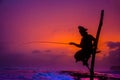 Silhouettes of the traditional Sri Lankan stilt fishermen Royalty Free Stock Photo