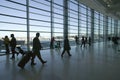 Silhouettes of travelers and airline industry personnel walking in Newark International Airport, New Jersey