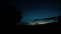 Silhouettes of tree and field