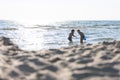 Silhouettes of two boys by the sea, out of focus Royalty Free Stock Photo