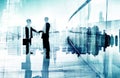 Silhouettes of Two Businessmen Having a Handshake Royalty Free Stock Photo