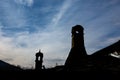 Silhouettes of two chimneys at dusk Royalty Free Stock Photo