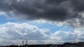 Silhouettes of two muslim minarets on a background of a beautiful cloudy sky. Allah sends the rays of the sun to the blessed earth Royalty Free Stock Photo