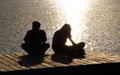 Silhouettes of two young people