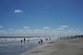 Silhouettes of vacationers enjoying the beach