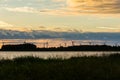 Silhouettes of wind power stations in a row at the east coast of Royalty Free Stock Photo