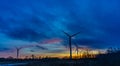 Silhouettes of wind turbines with a beautiful sunset Royalty Free Stock Photo