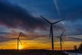 Silhouettes of wind turbines with a beautiful sunset Royalty Free Stock Photo