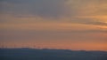 Silhouettes of wind turbines during sunset. Royalty Free Stock Photo