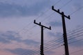 Silhouettes of wires and electric post