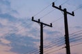 Silhouettes of wires and electric post