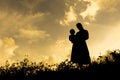 Silhouettes of a women with her kid Royalty Free Stock Photo