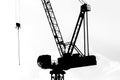 Silhouettes of working crane