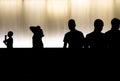 Silhouettes of young boys walking in the summer night in high contrast black and white