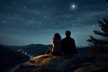 Silhouettes of a young couple admiring beautiful view on sunset. Man and woman looking at scenic night landscape