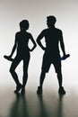 Silhouettes of young fit couple