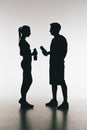 Silhouettes of young fit couple