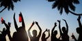 Silhouettes of Young People Celebrating, Drinking on a Beach Royalty Free Stock Photo