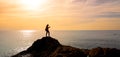 Silhouettte of woman photographer taking photo on sunset Royalty Free Stock Photo