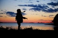 Silhouhette of a child girl walking in the sunset Royalty Free Stock Photo