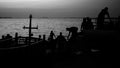 Silhoutte of fisherman work at port