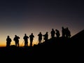 Silhoutte of Group of Photographers Shooting Sunrise