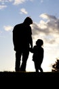 Silhoutte Of Loving Moment Between Father and Young Child