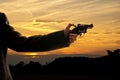 Silhoutte of a man with a handgun Royalty Free Stock Photo