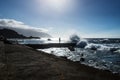 Silhoutte of a man in a natural ocean pool with a huge splash at Frontera, El Golfo, El Hierro, Canary Islands, Spain Royalty Free Stock Photo